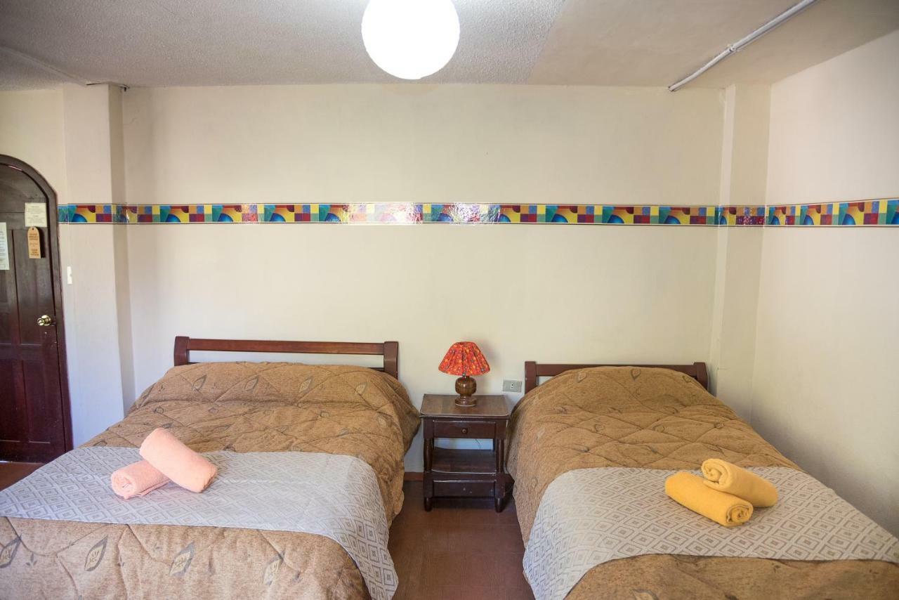 Hotel Flor De Oriente Baños Стая снимка